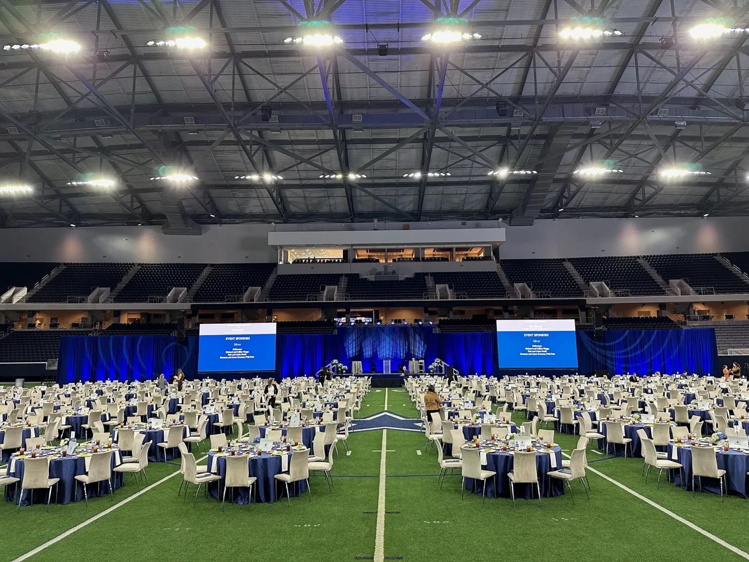 Large corporate gala setup on the football field at The Star in Frisco with professional AV production.
